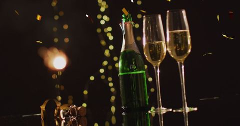 Festive New Year Celebration with Champagne and Confetti