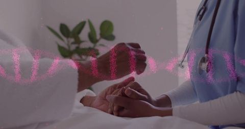 Nurse holding hands comforting elderly patient at bedside, dna overlay suggesting compassionate care