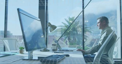 Focused Businessman Working in Bright Corporate Office - Download Free Stock Images Pikwizard.com