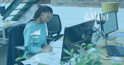 Businesswoman Analyzing Digital Data at Office Desk