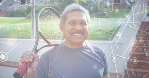 Senior Man Embracing Active Lifestyle with Tennis Racket