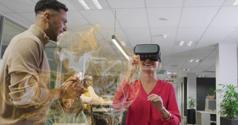 Team Experiencing Virtual Reality with Holograms in Office Environment