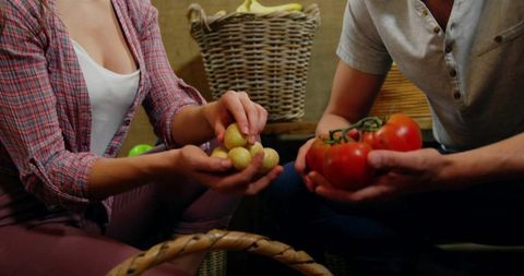 Couple Sorting Fresh Produce in Rustic Pantry Setting