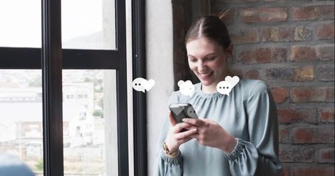 Woman engaging on smartphone with digital icons overlay