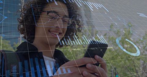 Smiling young man checking smartphone with augmented data visualizations in urban park