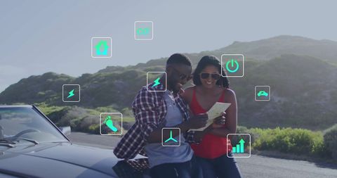 Happy Couple with Eco-Friendly Technology Icons on Road Trip