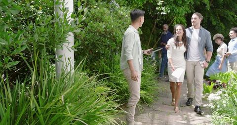 Joyful Outdoor Gathering at Garden Event with Friends