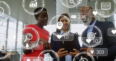 Executives Collaborating with AR Analytics on Tablet in Modern Atrium for Digital Strategy