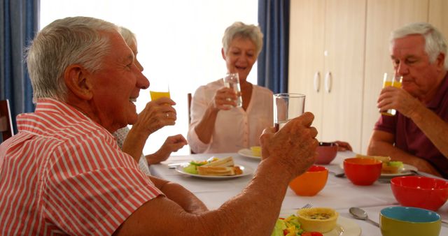 Senior Friends Enjoying Breakfast Together around Table - Download Free Stock Images Pikwizard.com