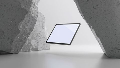 Futuristic hovering tablet with stone pillars and minimalist design