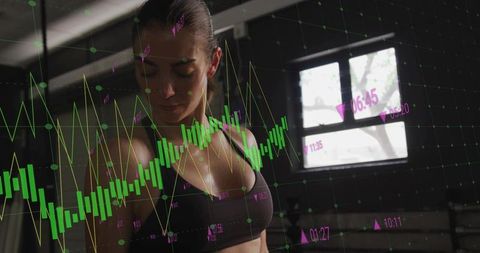 Athletic Woman Analyzing Performance with Interactive Data Visualizations