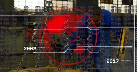 Engineer aligning metal component with digital globe overlay