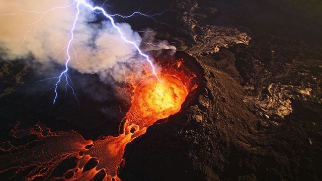 Erupting lava lake feeding glowing channels with volcanic lightning, dramatic aerial view