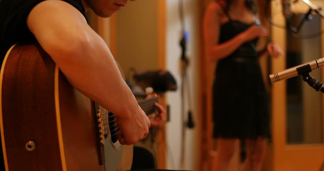 Musician Playing Guitar in Recording Studio with Singer - Download Free Stock Images Pikwizard.com