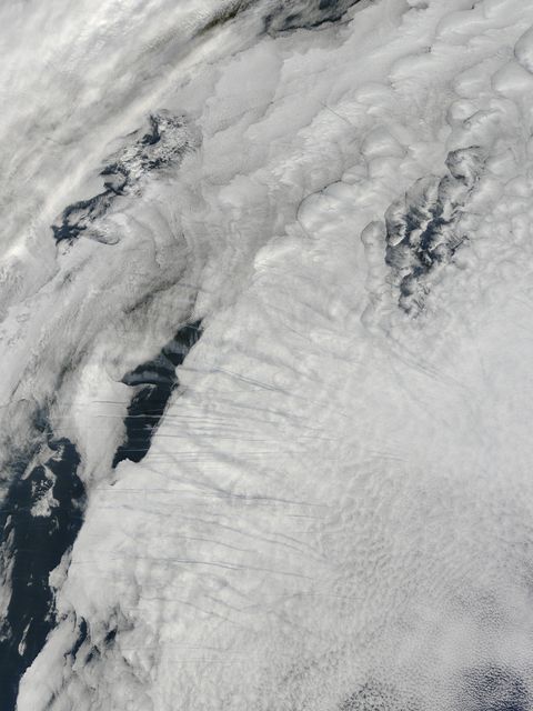 Satellite Image Captures Contrails over Clouds in North Atlantic Ocean - Download Free Stock Images Pikwizard.com