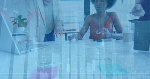 Digital financial data in business meeting with diverse professionals