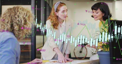 Diverse coworkers planning business growth with digital graphs