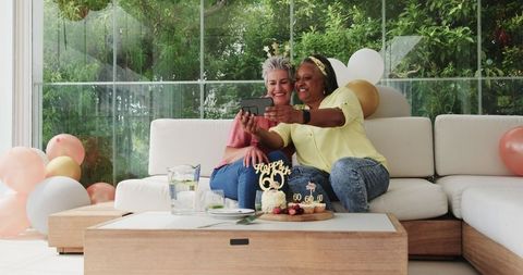 Lesbian Senior Couple Celebrating Birthday and Taking Selfie