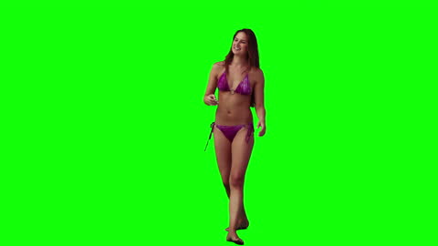 Woman in Bikini Throwing Frisbee with Green Screen Background