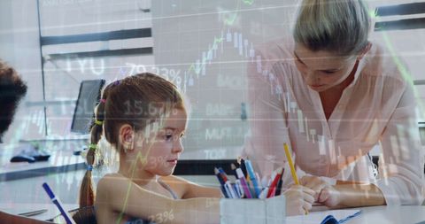 Teacher Assisting Student in Digitally Enhanced Classroom