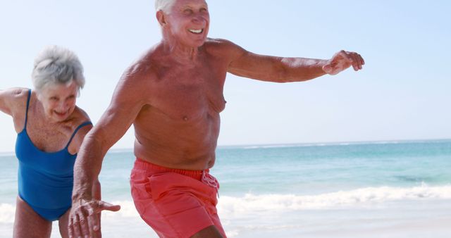 Senior Couple Enjoying Beach Fun in Summer - Download Free Stock Images Pikwizard.com