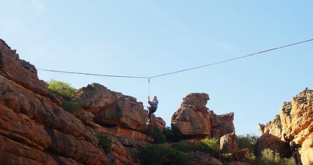 Man Ziplining Past Rocky Mountain Scenery - Download Free Stock Images Pikwizard.com