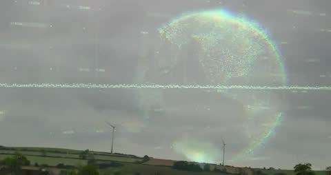 Futuristic 3D Globe Over Landscape with Wind Turbines and Data