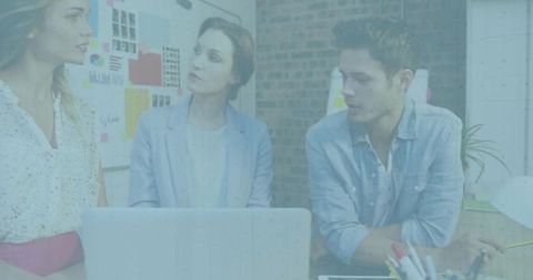 Creative design team brainstorming in modern office