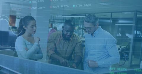 Team analyzing financial data together in modern office