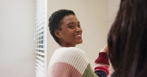 Diverse Women Socializing by Window in Cozy Home Atmosphere