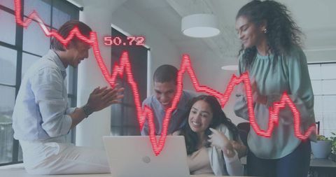 Diverse team celebrating stock market spike on laptop with red analytics chart overlay