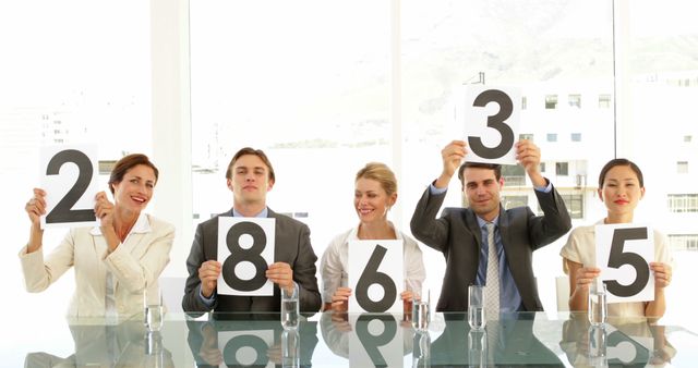 Businesspeople Judging Contest Holding Scorecards in Office - Download Free Stock Images Pikwizard.com