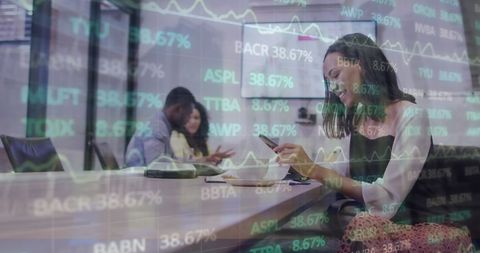 Woman in Office Analyzing Digital Financial Data Overlay