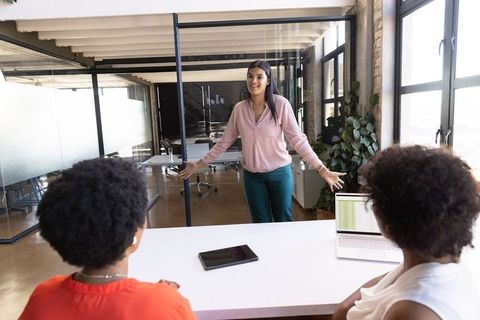 Diverse Coworkers Collaborating in Modern Office Meeting