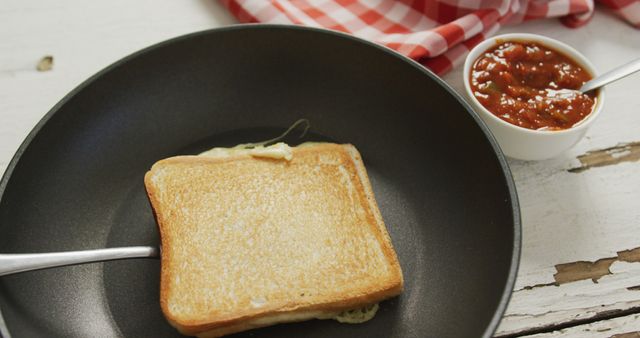 Image of freshly toasted cheese white bread sandwich prepared on frying pan. fusion food, breakfast and home made snack concept.