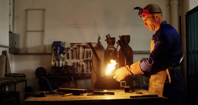 Metalworker Performing Melting Process in Industrial Workshop - Download Free Stock Images Pikwizard.com