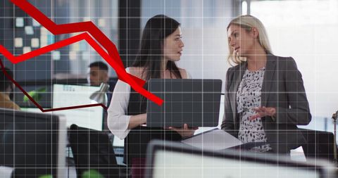 Businesswomen Analyzing Trends with Declining Graph Concept