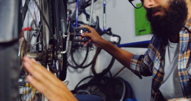 Bearded Bike Mechanic Inspecting Bicycle in Workshop - Download Free Stock Images Pikwizard.com