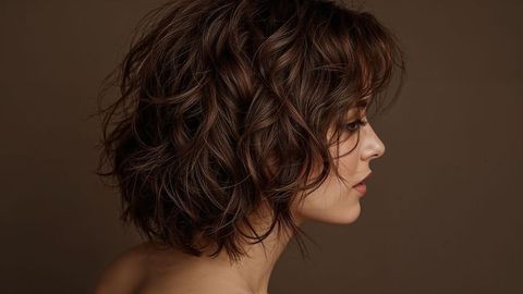 Elegant tousled brunette hair beautiful lady portrait in minimalistic setting