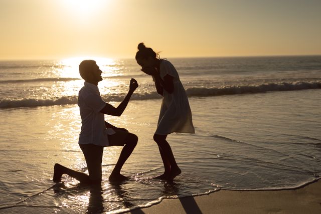 Man proposing woman at seashore on the beach - Download Free Stock Photos Pikwizard.com