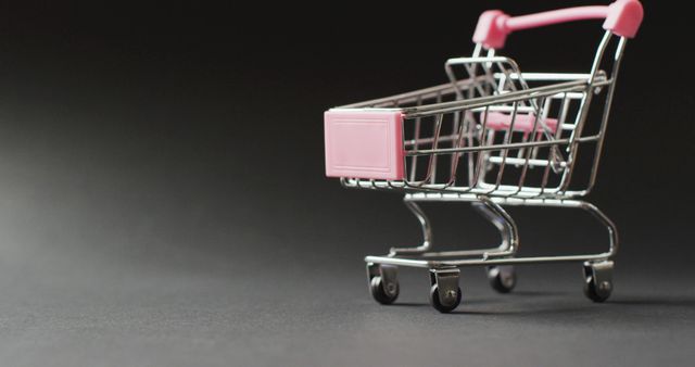 Mini Shopping Cart on Black Background for Retail Concept - Download Free Stock Photos Pikwizard.com