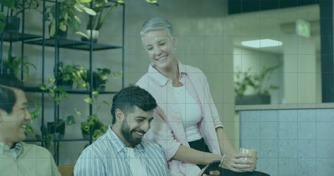 Relaxed Office Team Leisurely Discusses Using Tablet