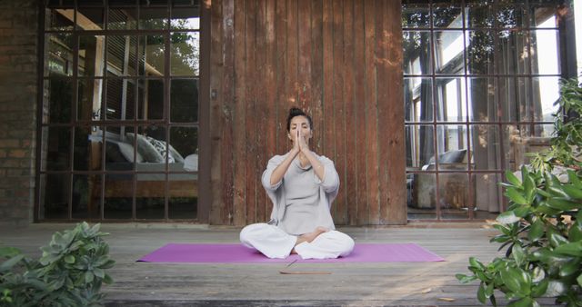 Woman Practicing Yoga Meditation Outdoors on Patio - Download Free Stock Images Pikwizard.com