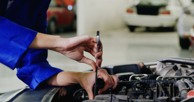 Mechanic Fixing Car Engine in Garage - Download Free Stock Images Pikwizard.com