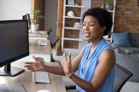 Businesswoman Discussing in Modern Office Environment