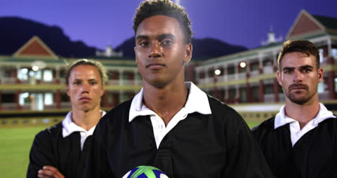 Determined Rugby Players at Stadium Sunset