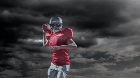 Determined Rugby Player Preparing to Throw Under Stormy Skies