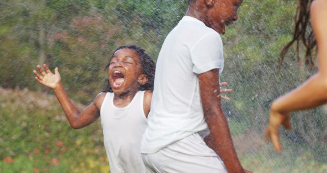 Excited Children Playing in Water Outdoors - Download Free Stock Images Pikwizard.com