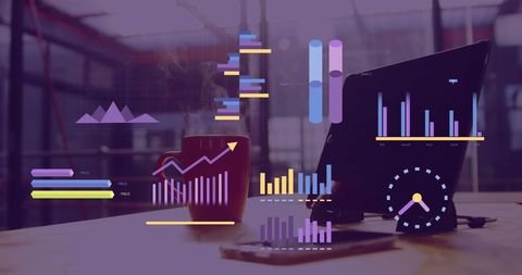 Visual Data Analysis on Laptop Desk with Technological Charts