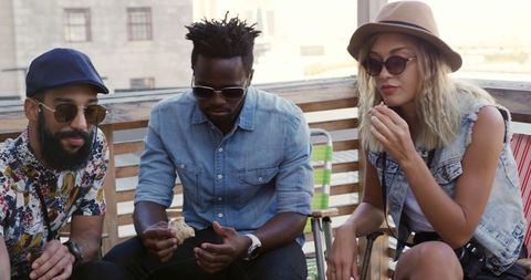 Diverse Friends Dining on Rooftop Gathering Enjoying Food and Drinks